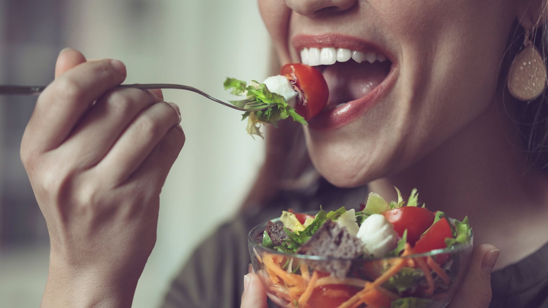 Woman enjoying a fresh salad.