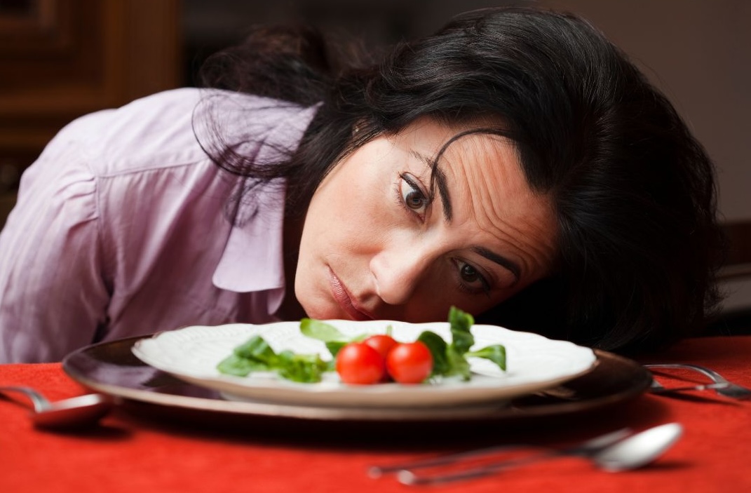 woman with salad on a plate