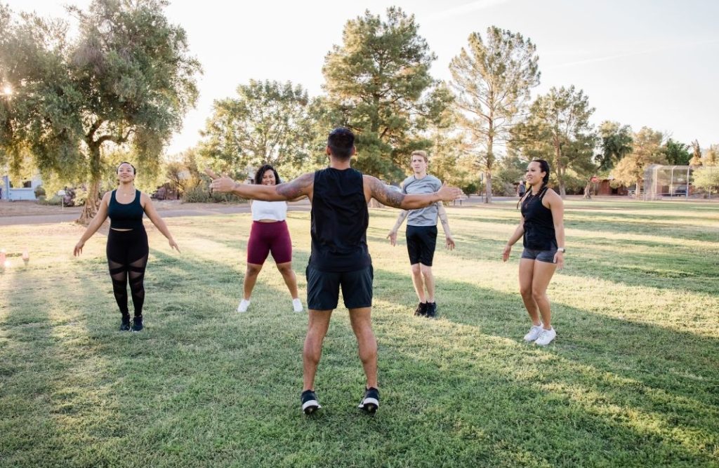 people having exercise in a park